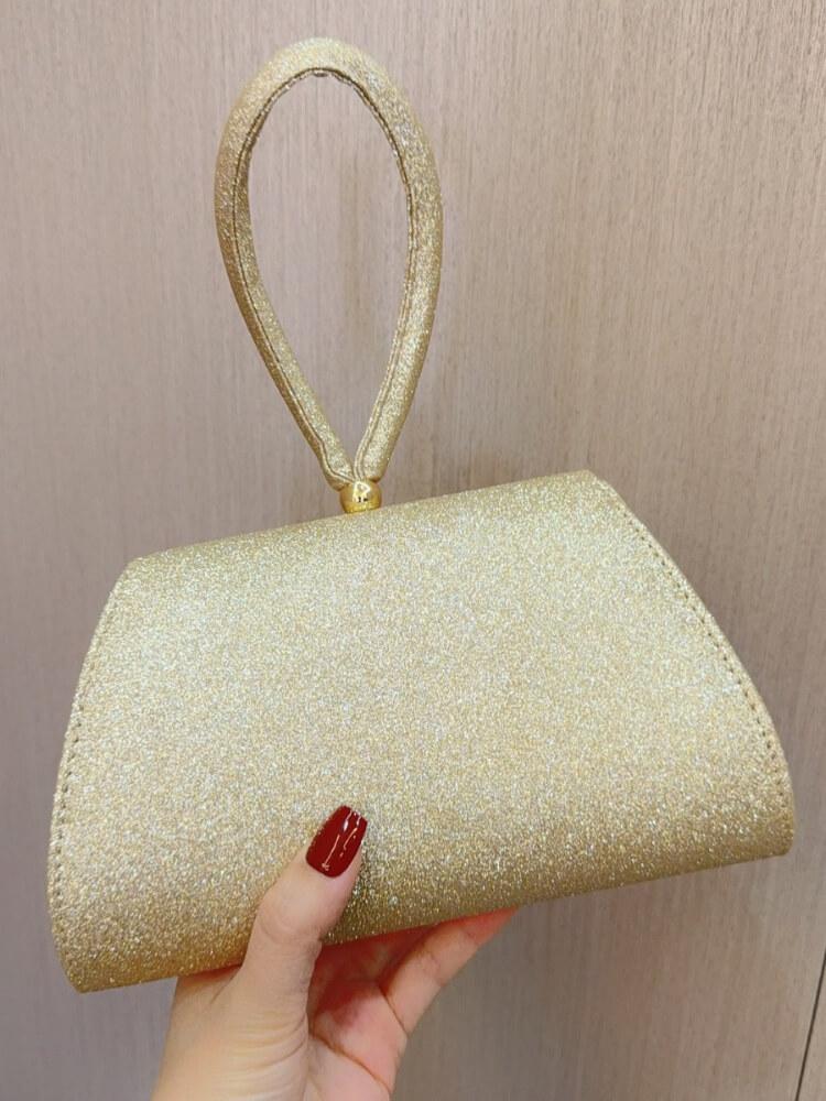 Diamond-encrusted Golden Handbag